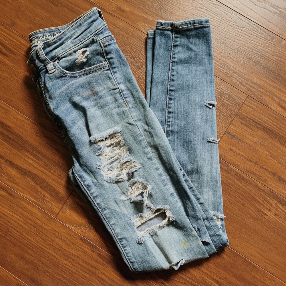 Ripped Blue Jeans with Paint Details